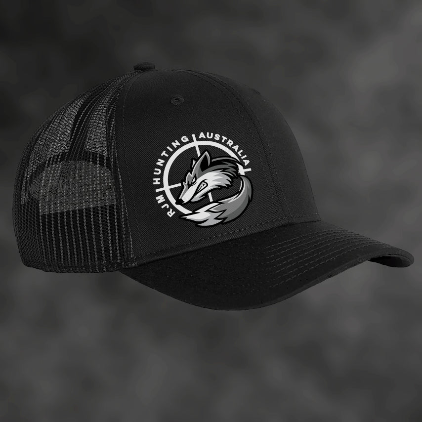 RJM Hunting Australia black trucker cap, angled view with mesh sides and fox logo