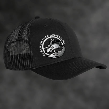 RJM Hunting Australia black trucker cap, angled view with mesh sides and fox logo