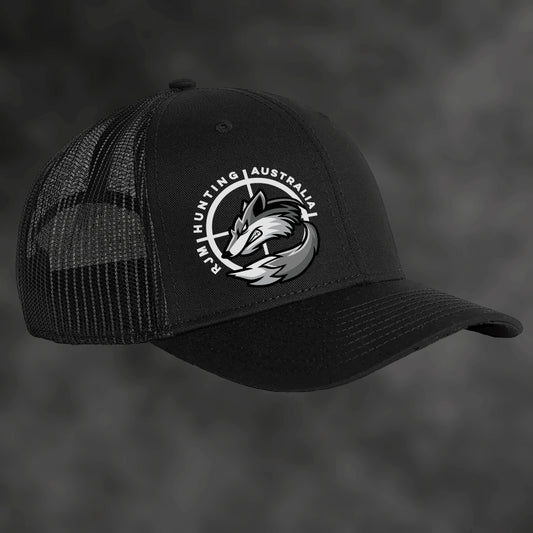 RJM Hunting Australia black trucker cap, angled view with mesh sides and fox logo